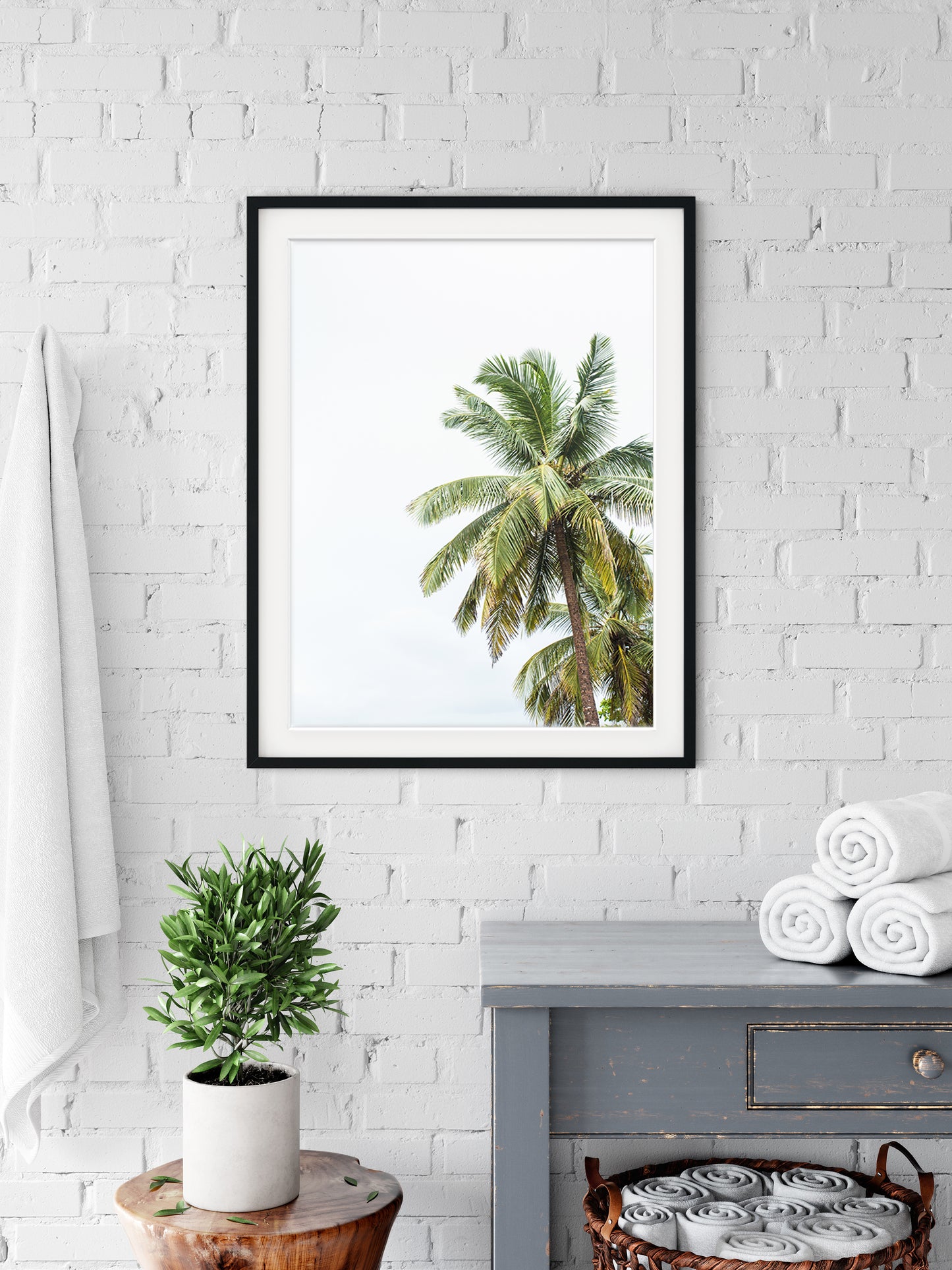 bathroom, washroom featuring palm tree photograph with black frame